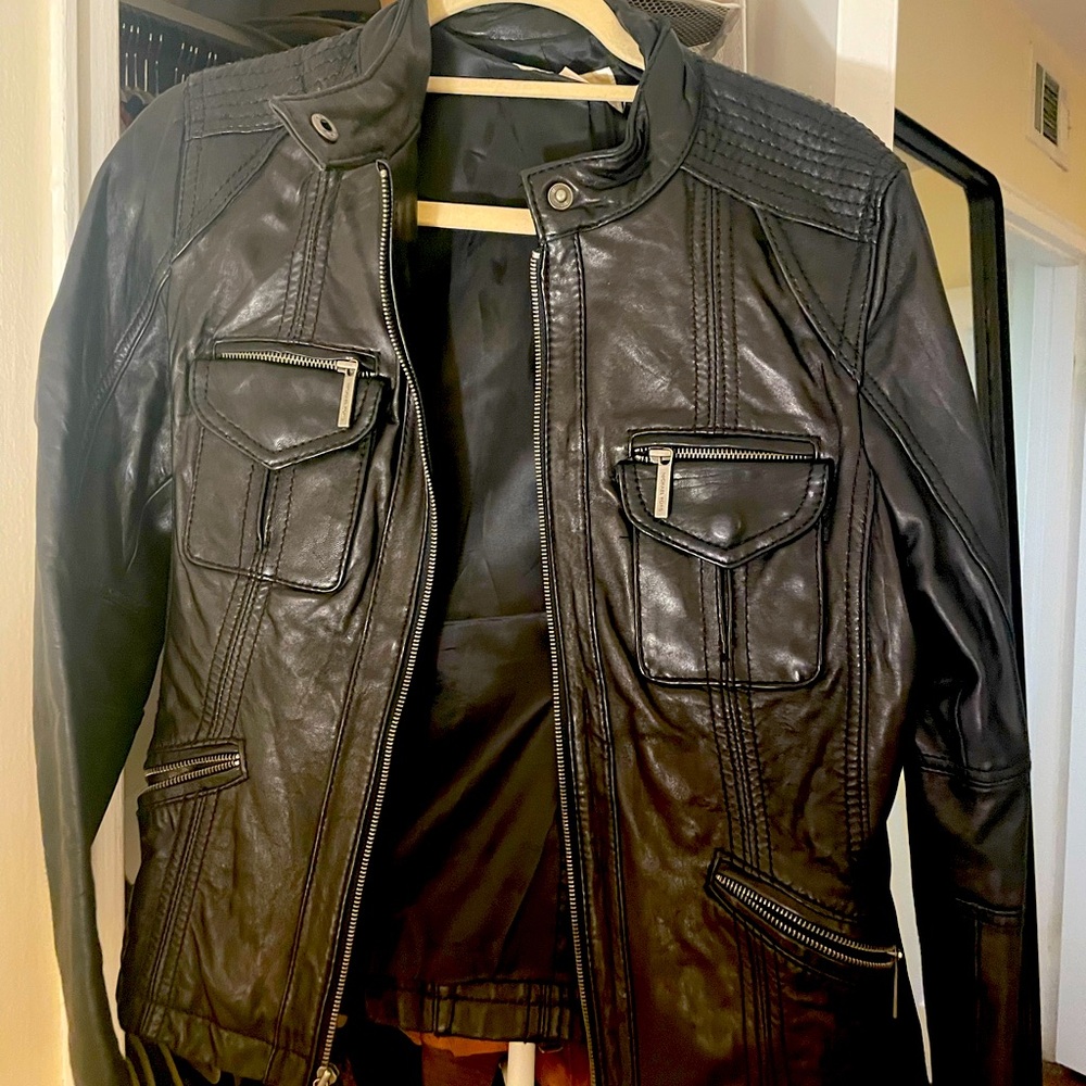 Michael Kors black leather jacket in women’s large.